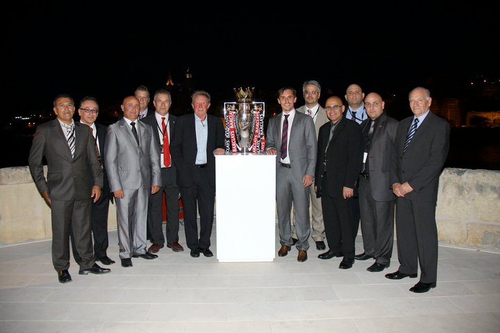 Gary Neville, Denis Law and MUSC Malta Committee with the Premier League Trophy